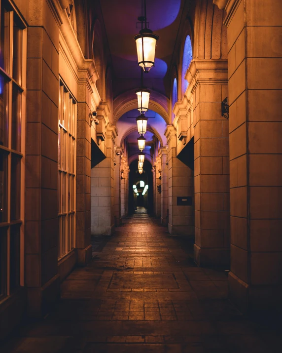 an image of a dimly lit hallway leading to a building