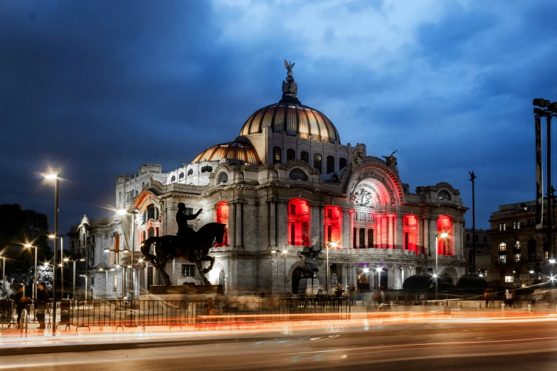 an ornate building is lit up at night