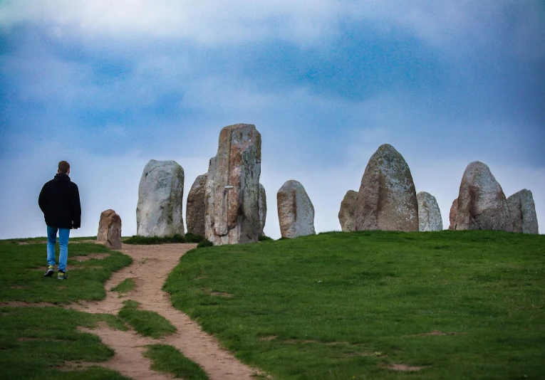 a person walking along a path through some rocks