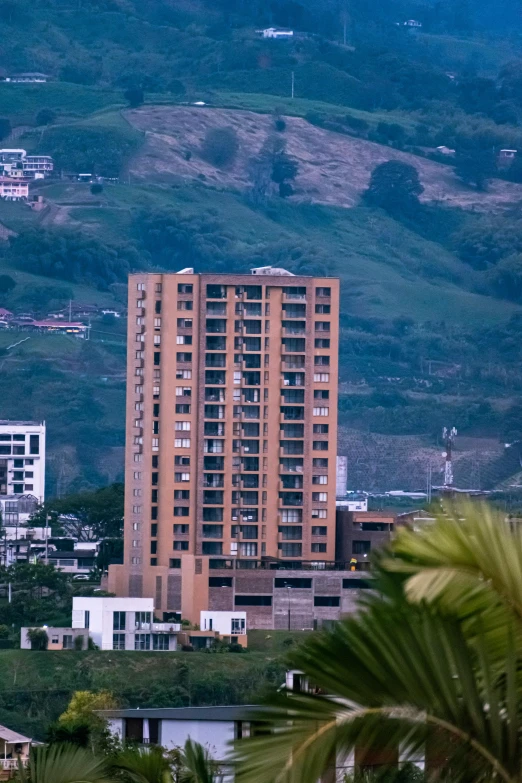 a building in the foreground with some buildings below