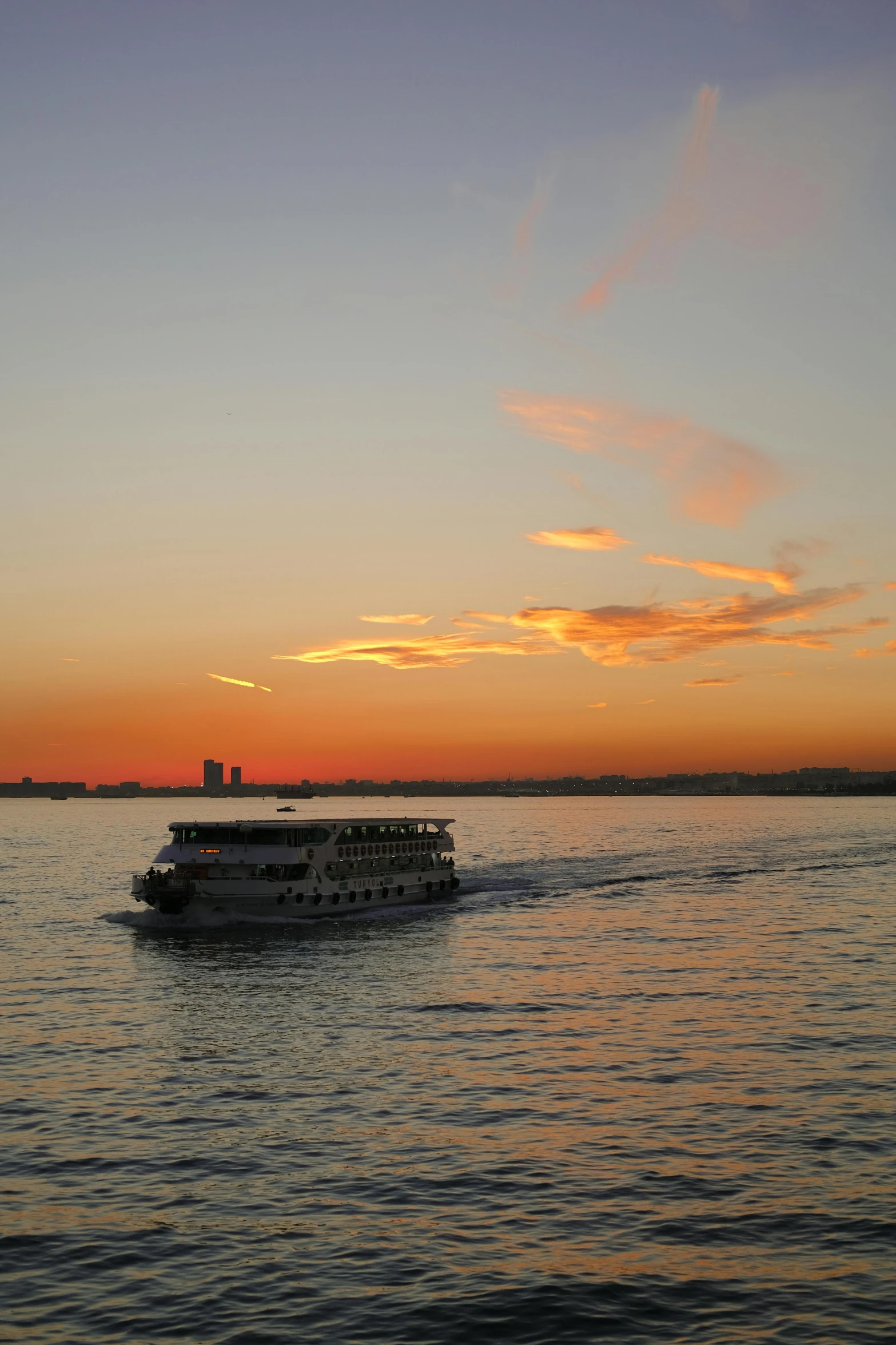 a boat is on the river at sunset