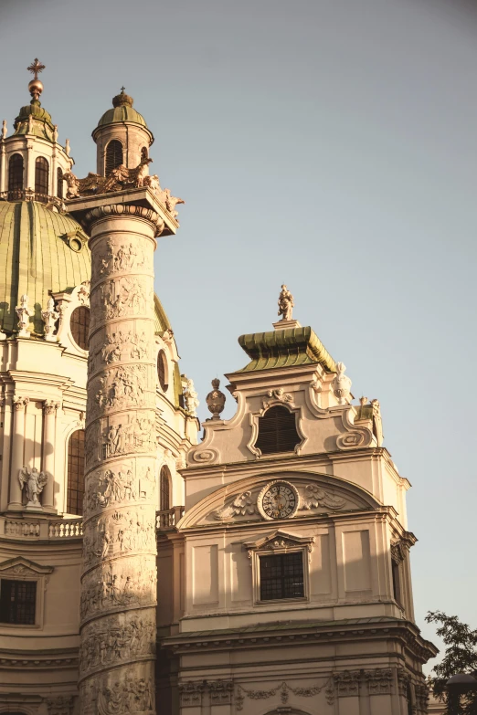 a building with a gold dome has a clock on it