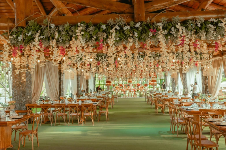 a room with a bunch of wooden tables and chairs