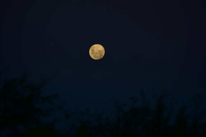 an image of a yellow moon that is lit up