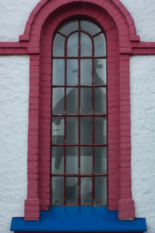 a building with window frames and glass windows