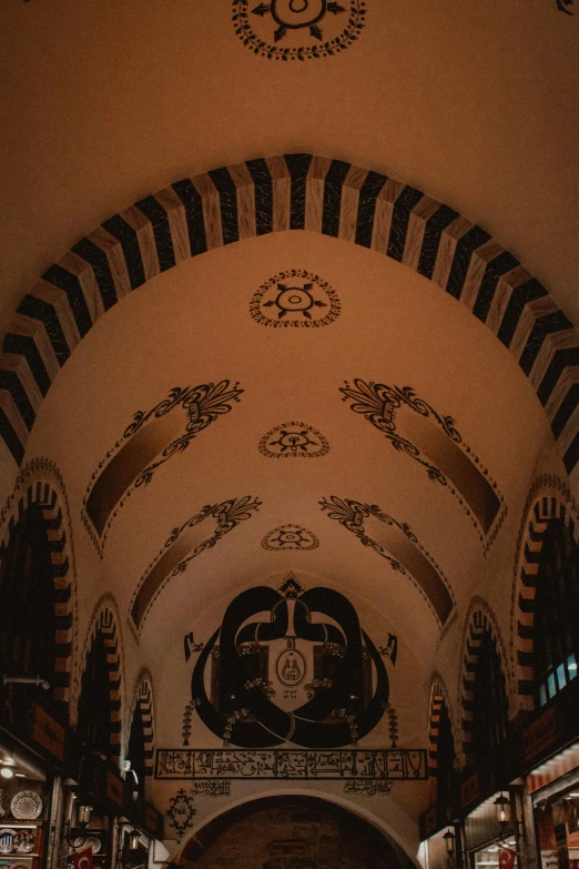 the ceiling is painted black and white with art work on it