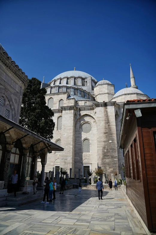 an ornate building with a very large courtyard