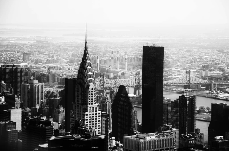 a very tall tower towering over a city filled with lots of tall buildings