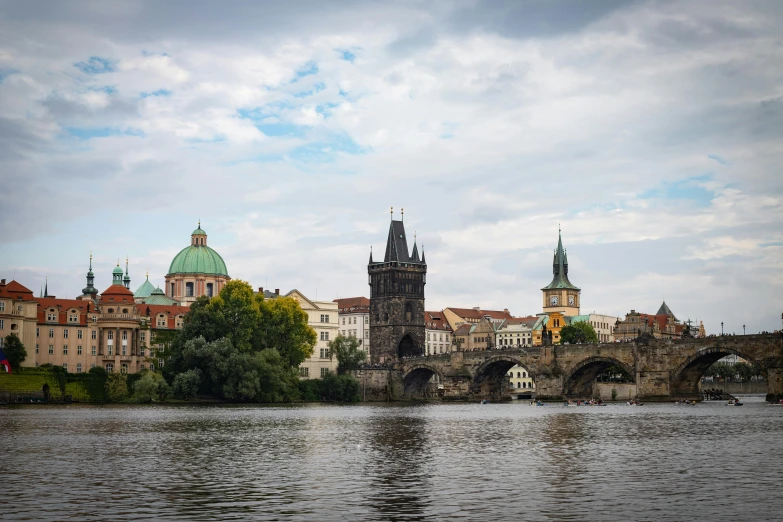 an old city sits on a river bank