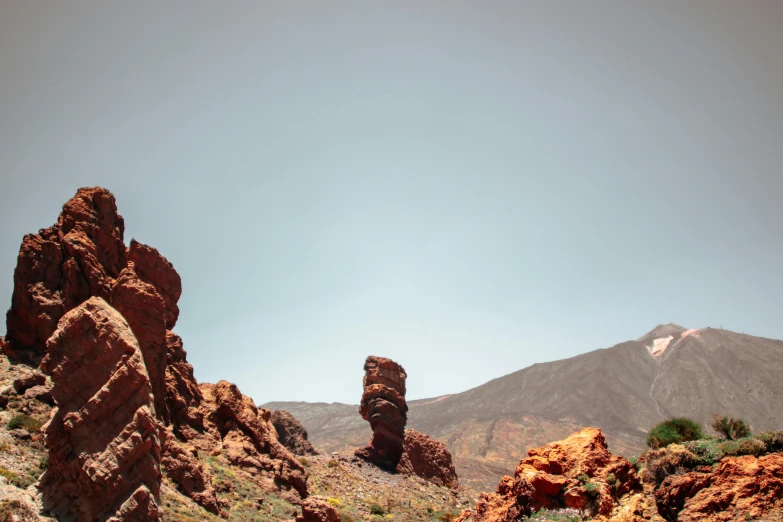 a very large mountain with some big rocks in it