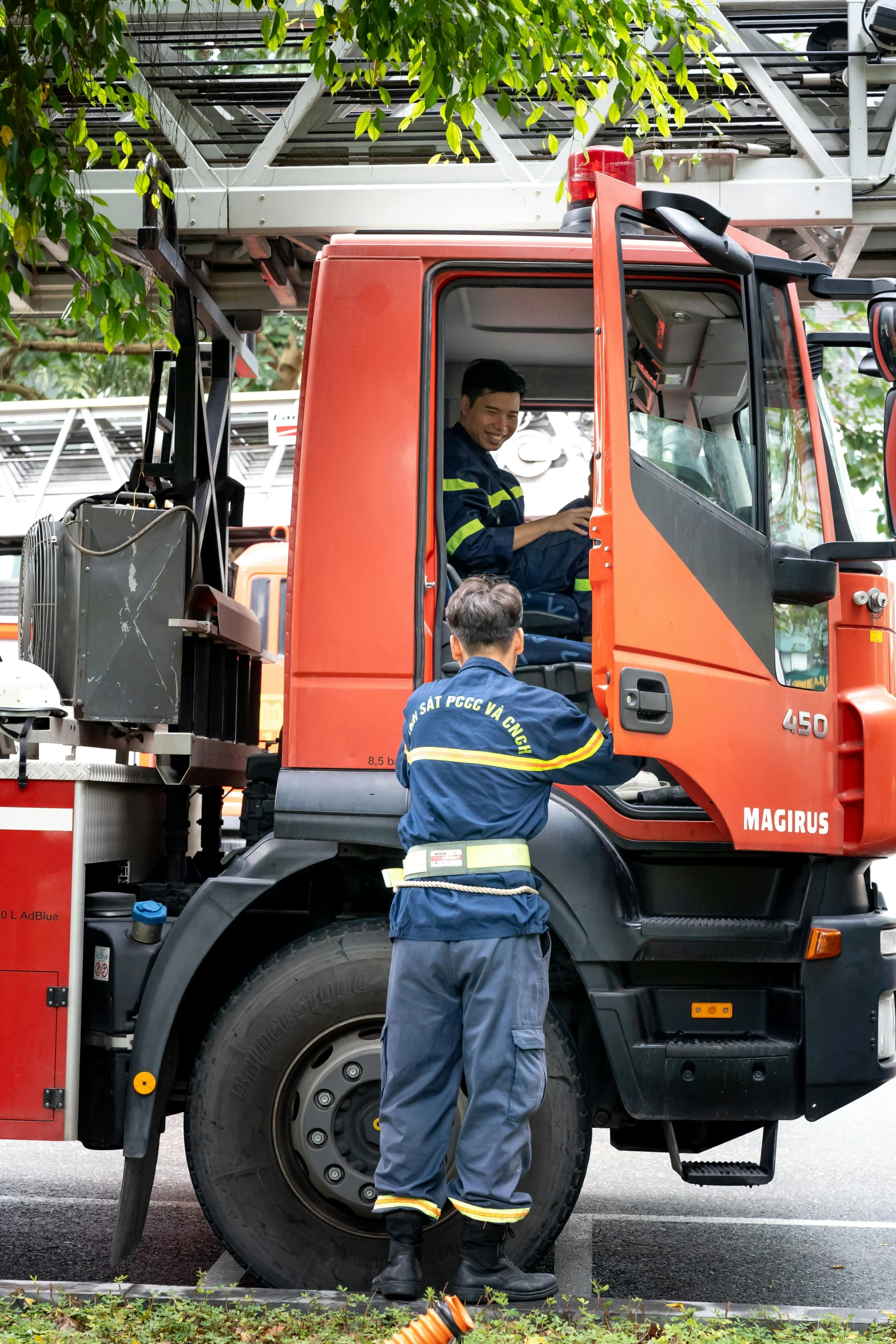 a couple of men standing next to a truck