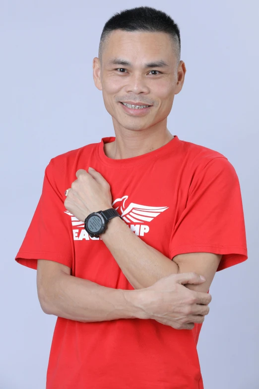a man with a red t - shirt and a black watch