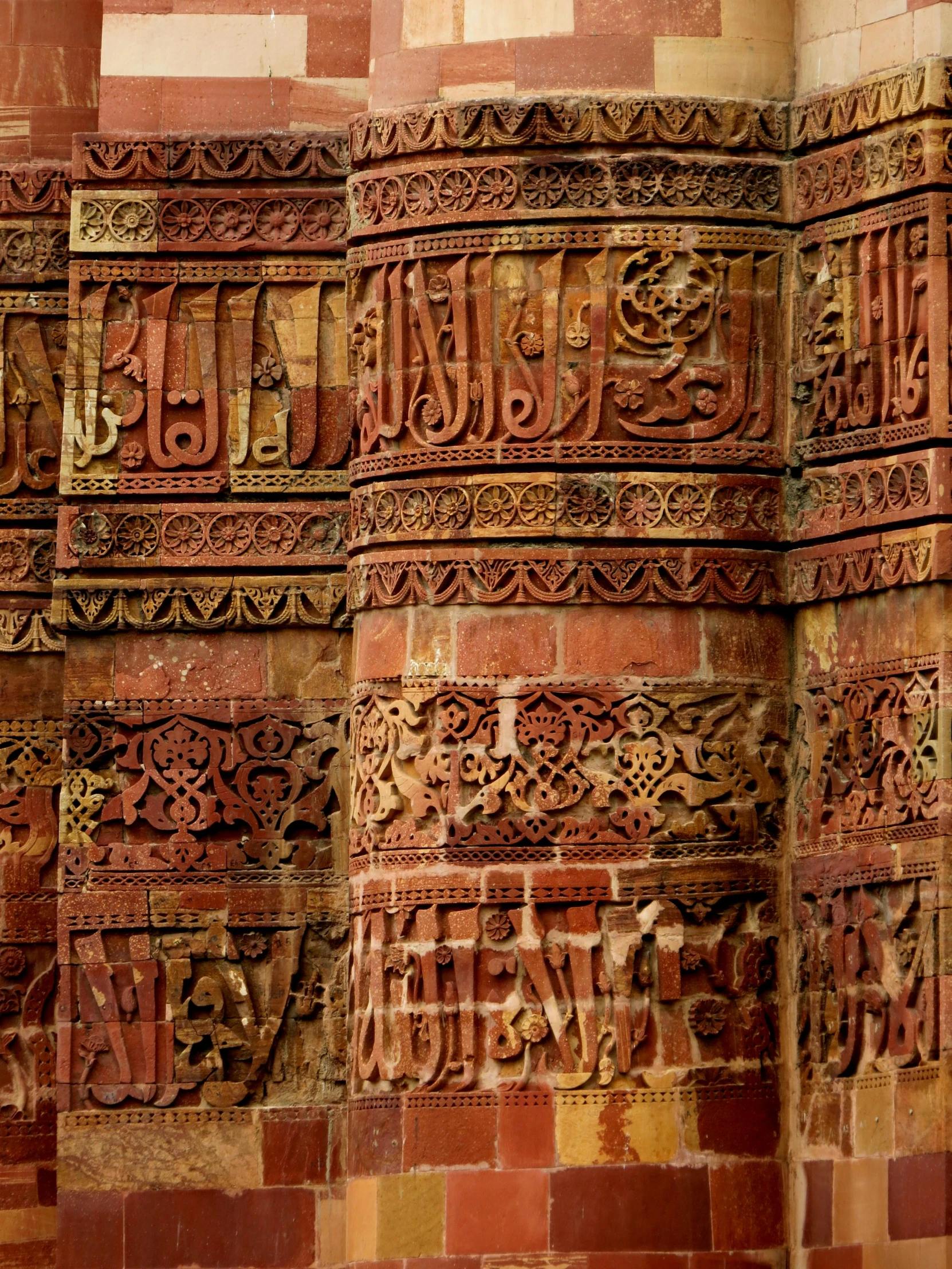 arabic writing on the brick walls, in different languages