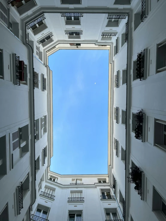 the view from below looking up at a building