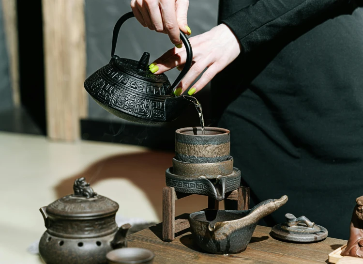 a person is standing near various items on a table