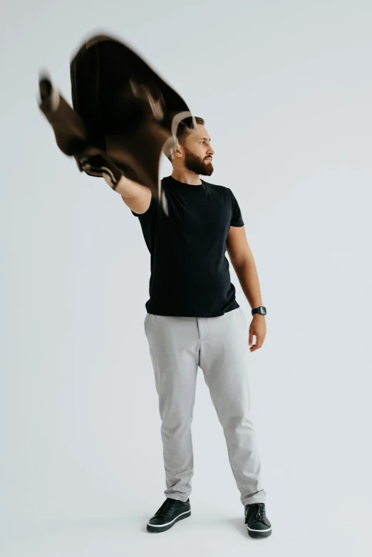 a man with an outstretched bird in front of his body