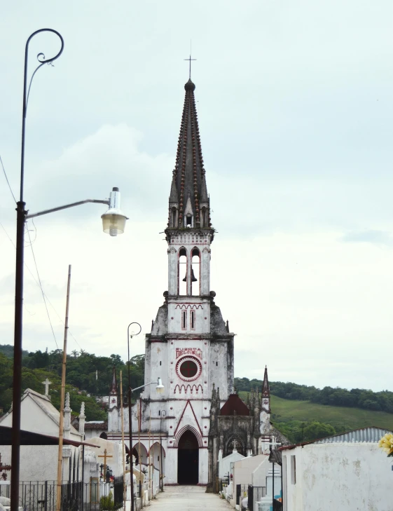 an old church with a steeple and a clock tower