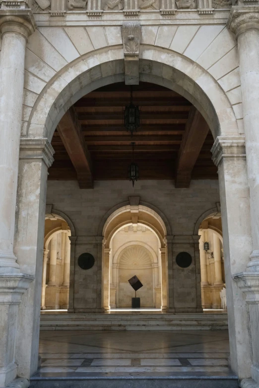 some arches and doors in a very big building