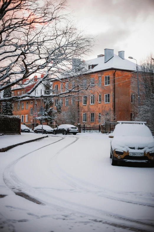 there is a snowy road in the middle of town