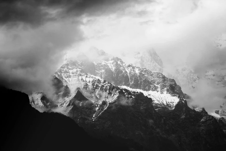 clouds passing by on a mountain covered with snow