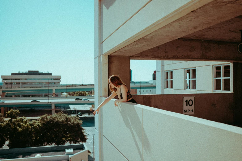 a person sitting on the side of a building