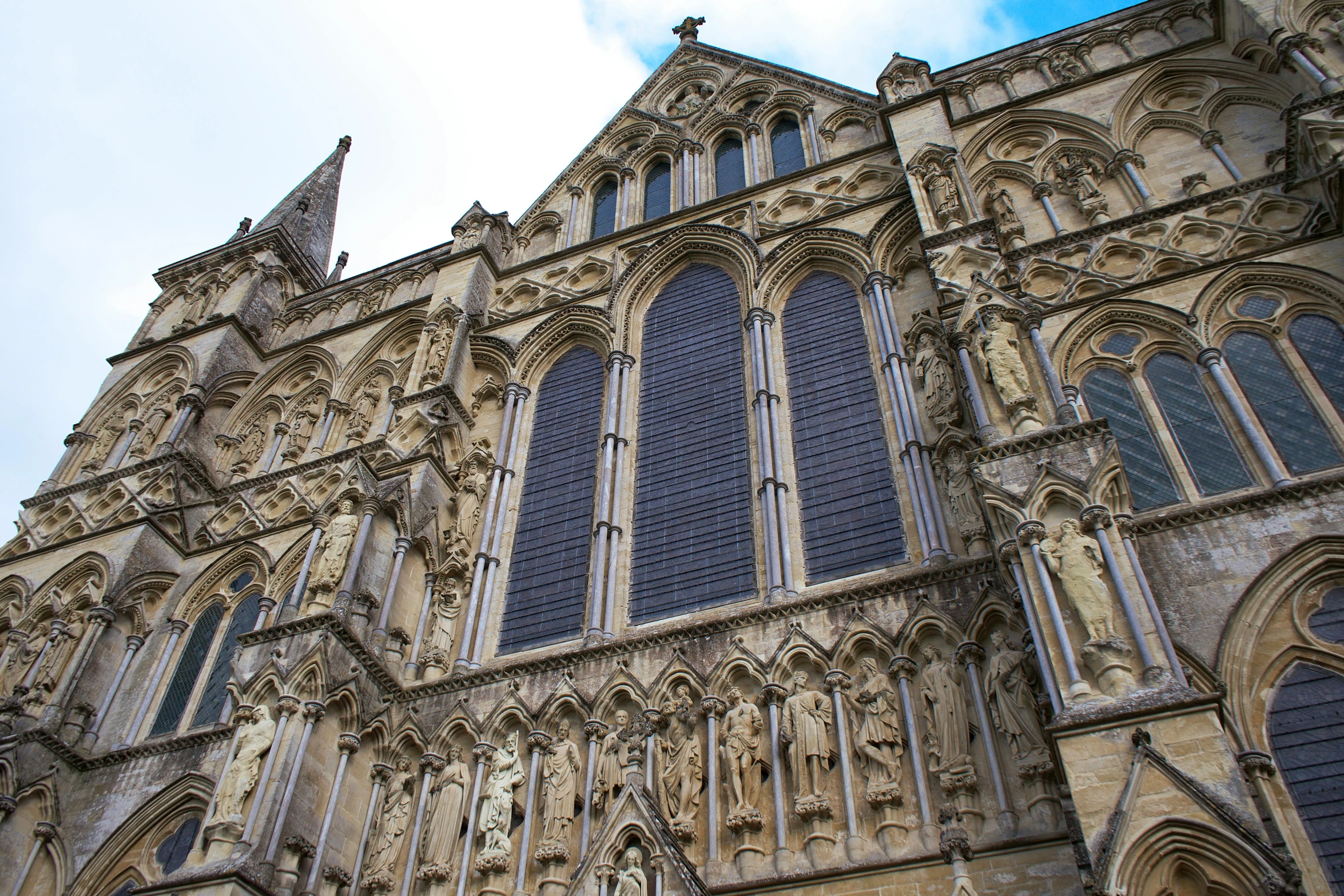 a church in the daytime looking up at its tall architecture