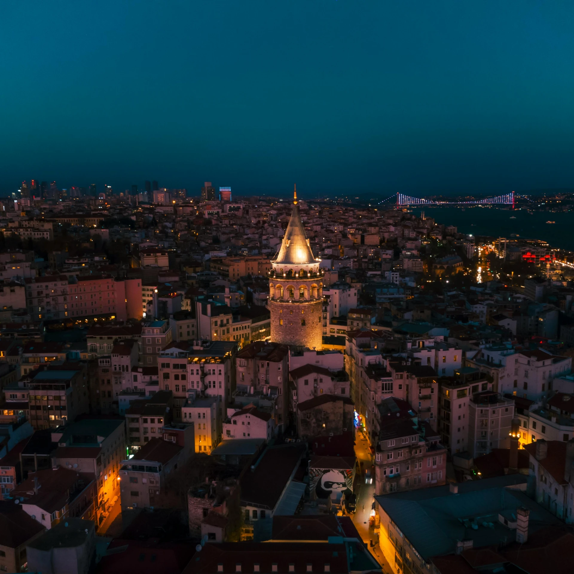 an urban skyline at dusk with a clock tower