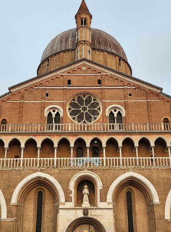 an old building with a domed clock on top