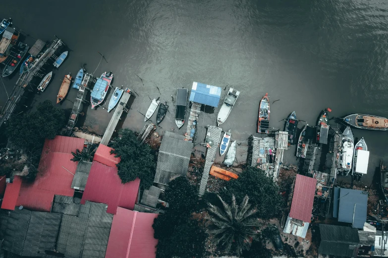 an aerial s of houses and boats on the river