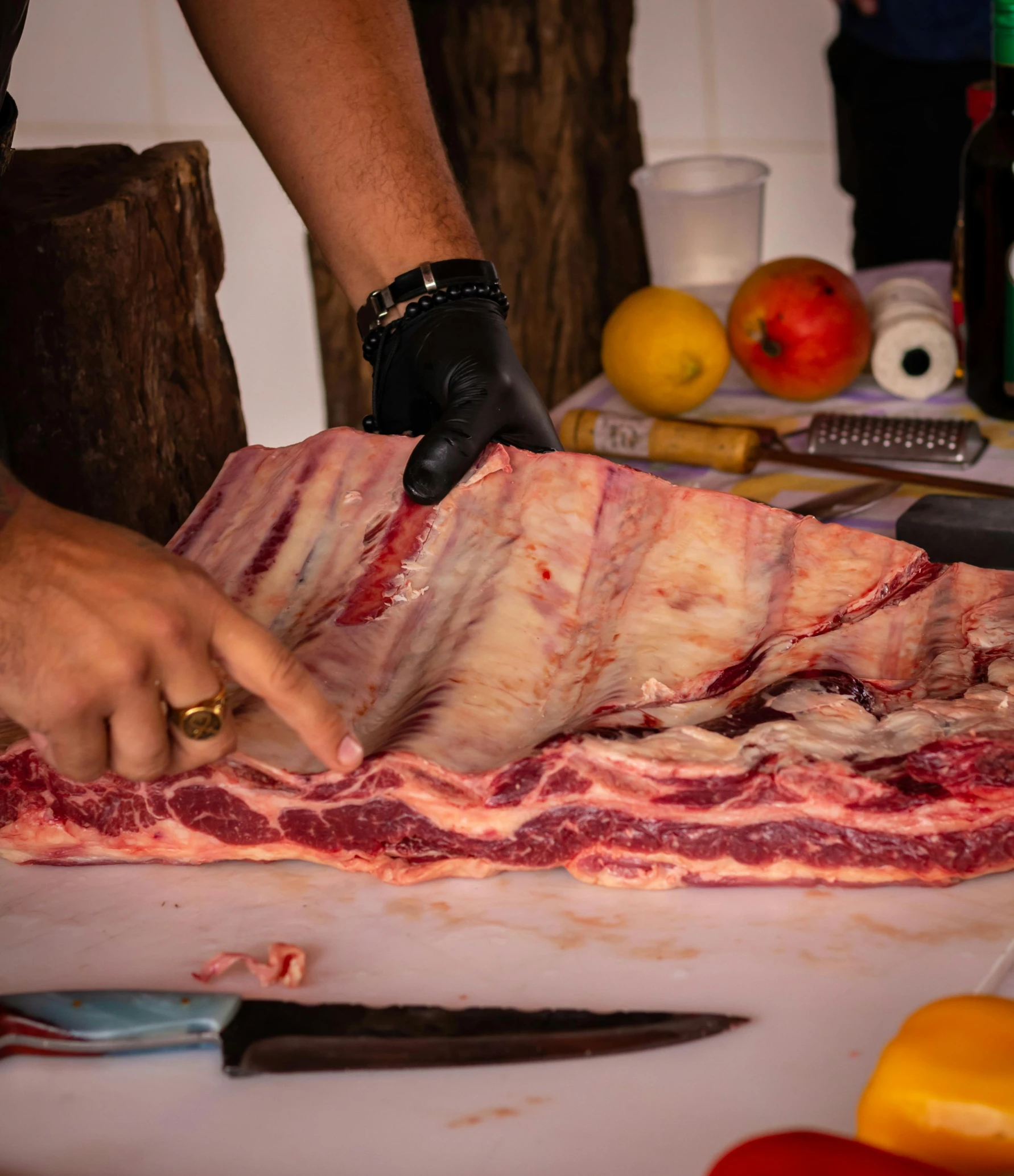 a man is peeling meat and chopping it