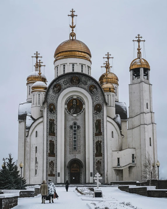 a church with some very big golden domes