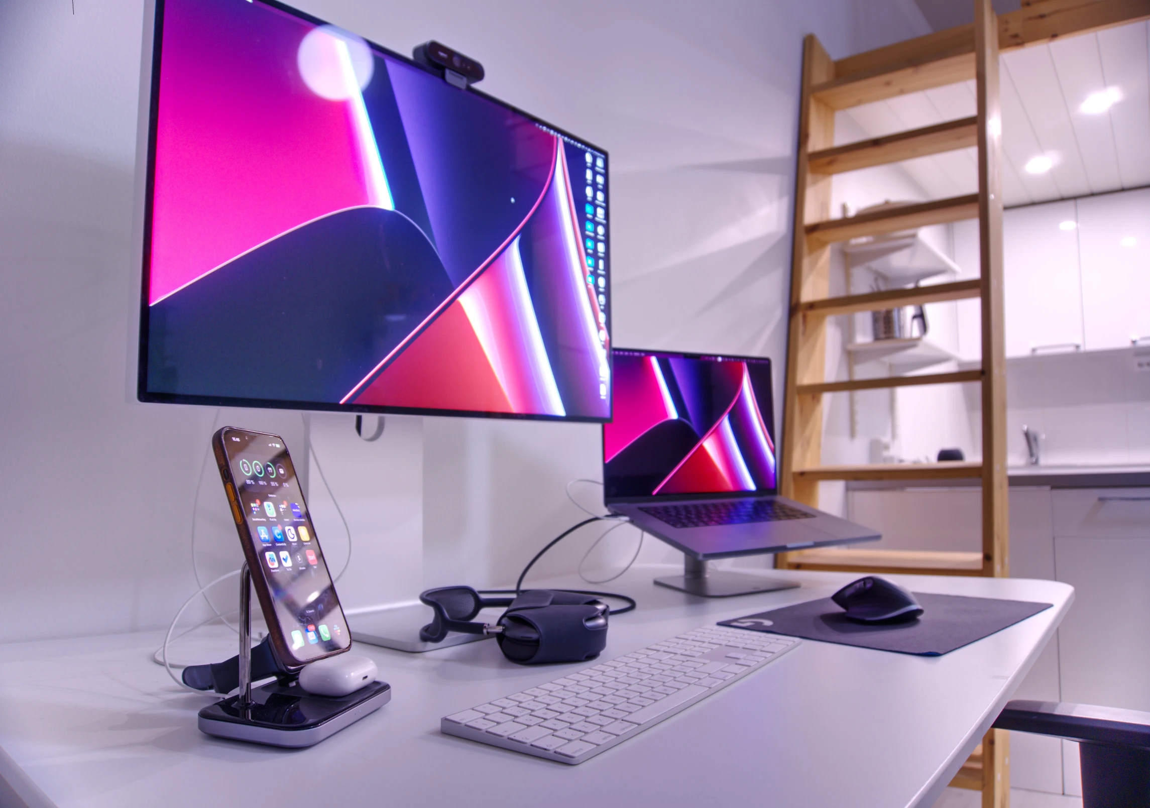 three computers on a desk with various mouses