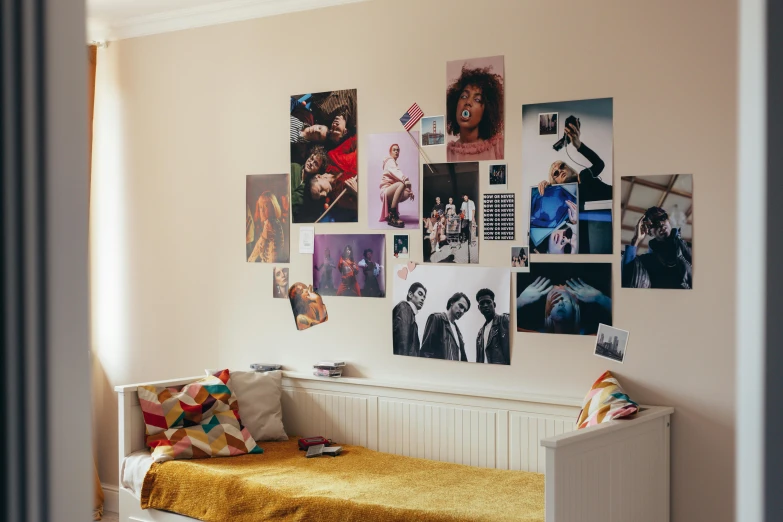 the room is decorated with many images on the wall