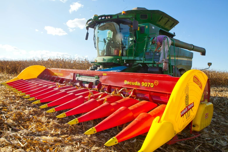 several large paddles laying across the back of a farm equipment