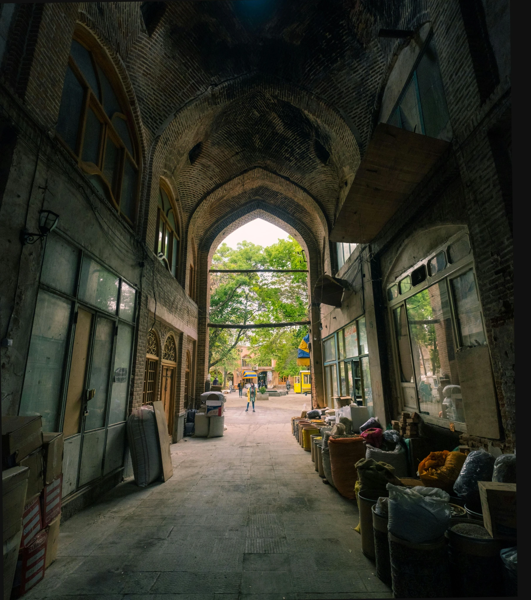 a hallway that has an arched entrance, and a view looking down on it