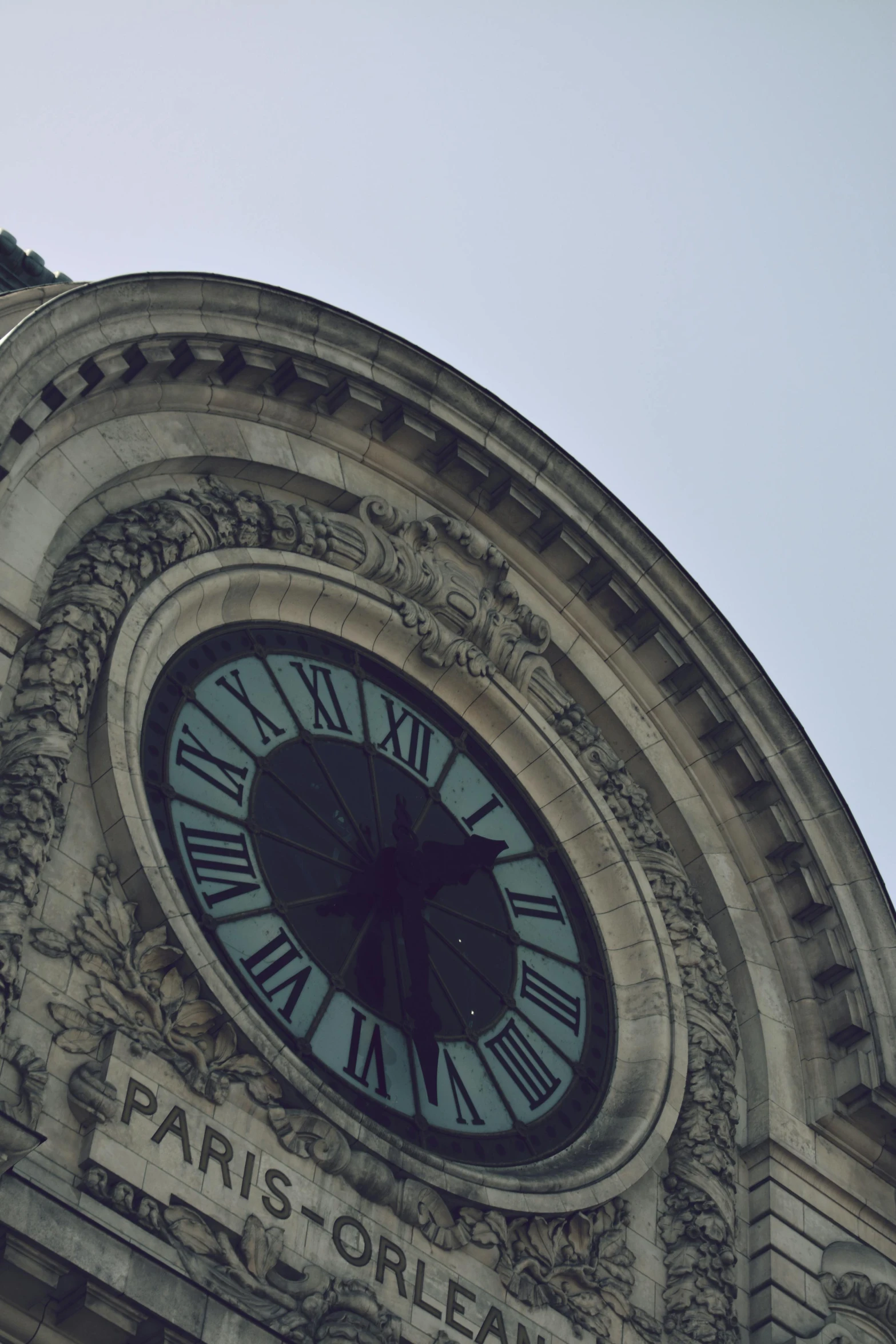 a large clock on the side of an old building