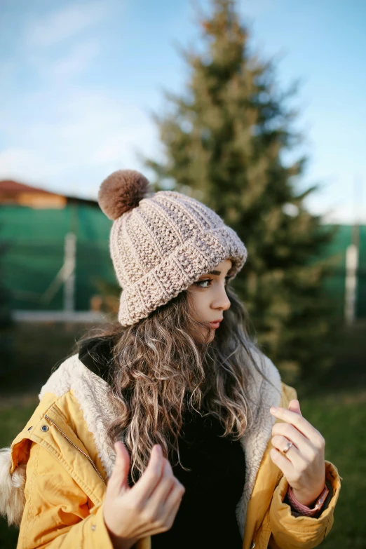 the woman is posing with her hands out for direction