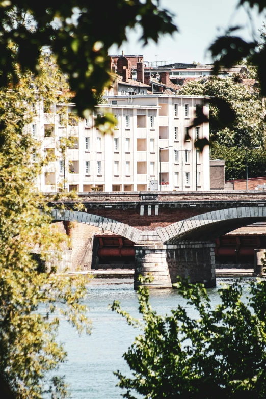 the city street bridge carries a lot of vehicles over the river