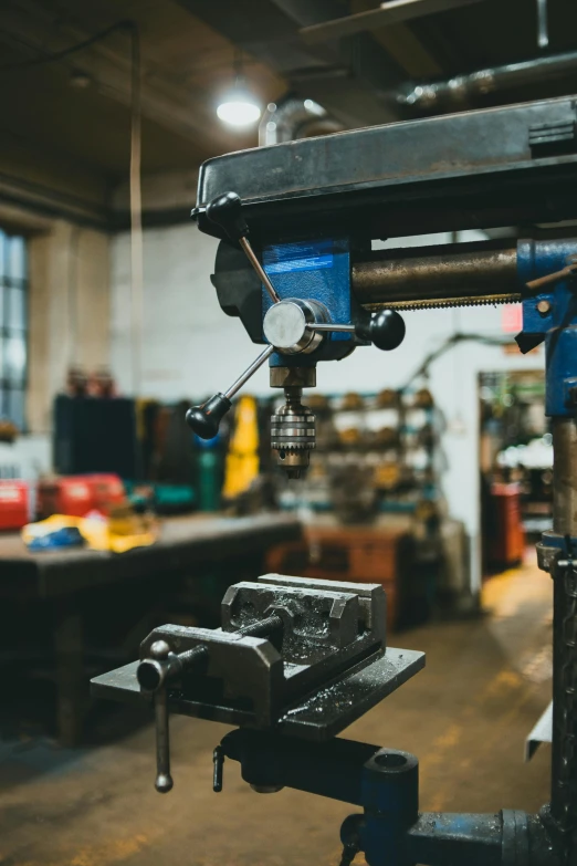 some steel working machinery in a factory with other metal work