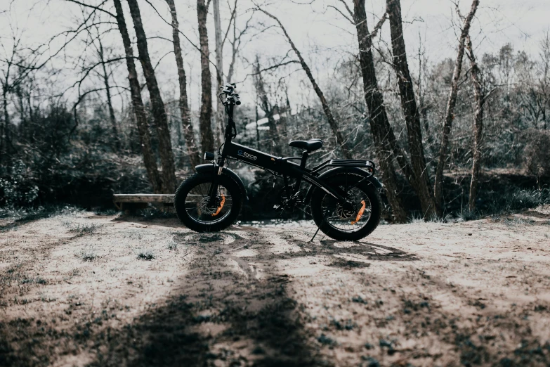 a motorcycle that is parked in the dirt