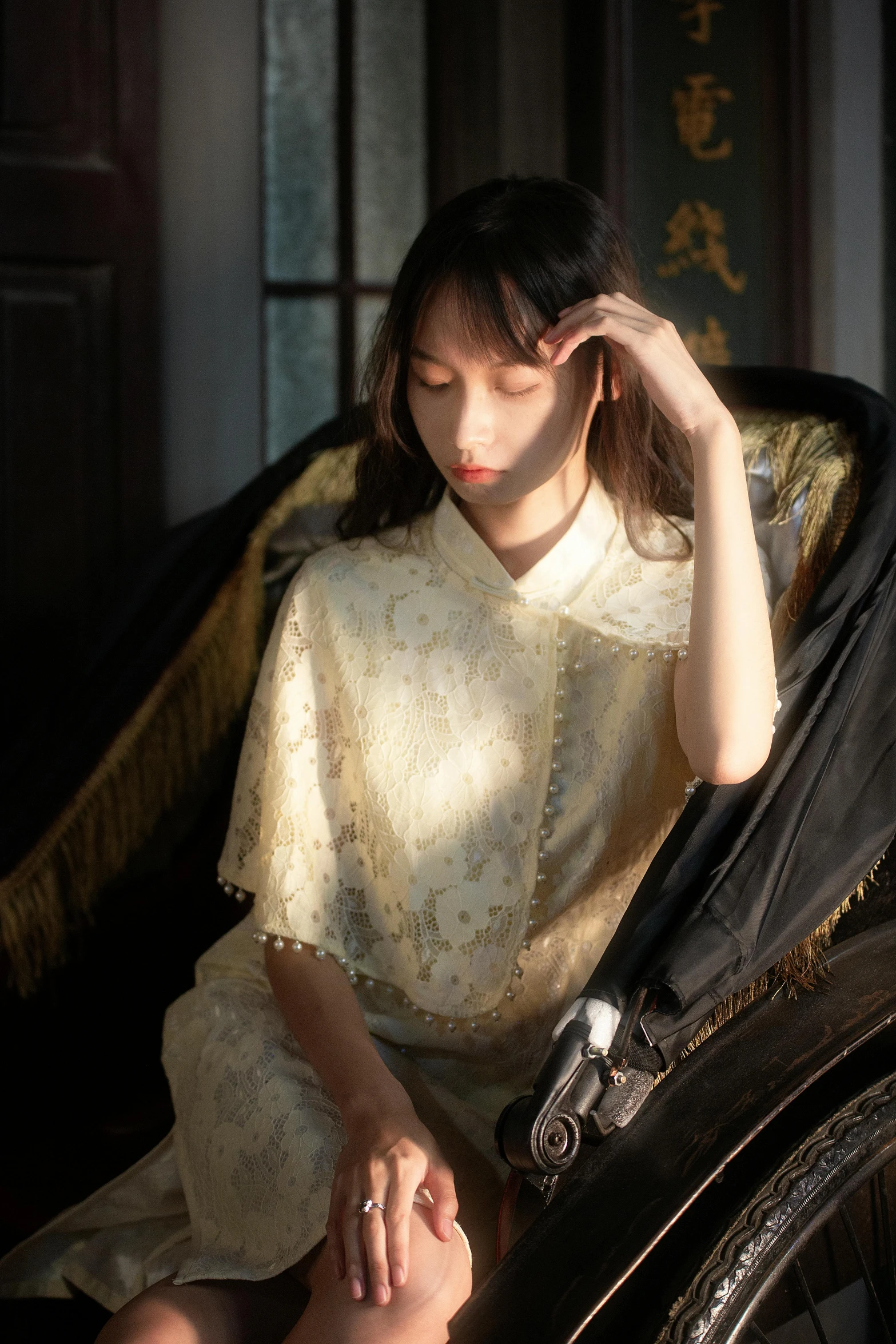 woman looking away while seated on old couch