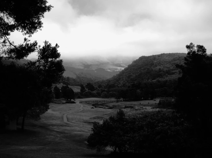 black and white image of the mountains in the rain