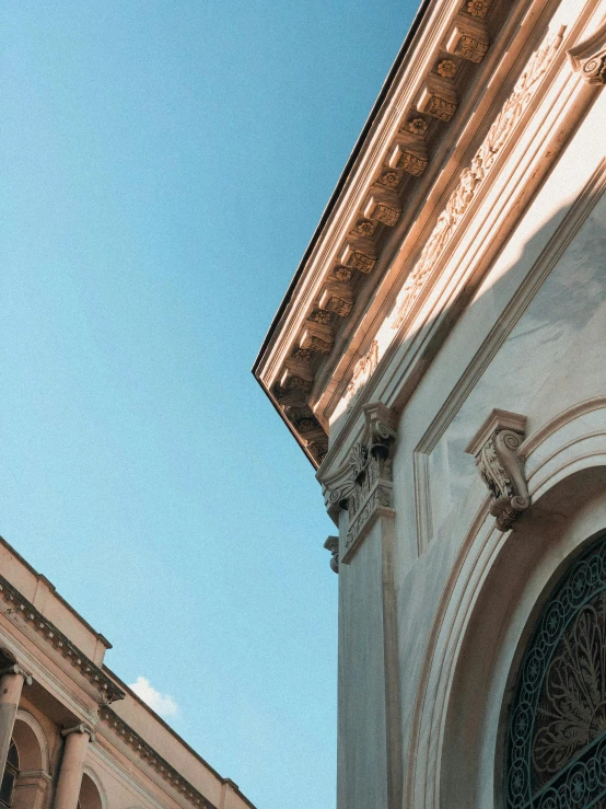 the roof of an old building with a clock on it