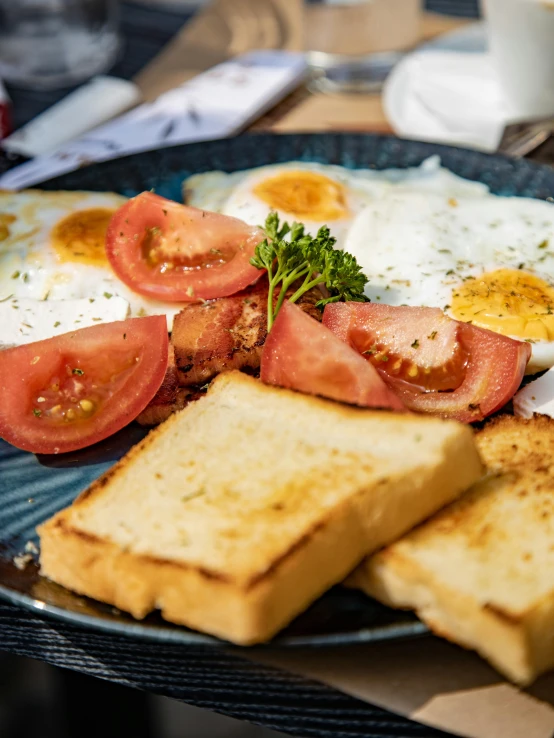 a plate of toast with a variety of foods on it