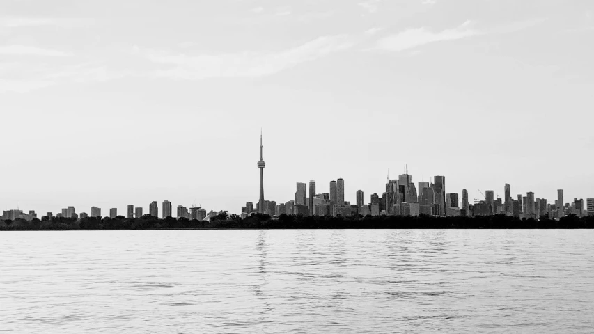 the view of the city from the water with no waves