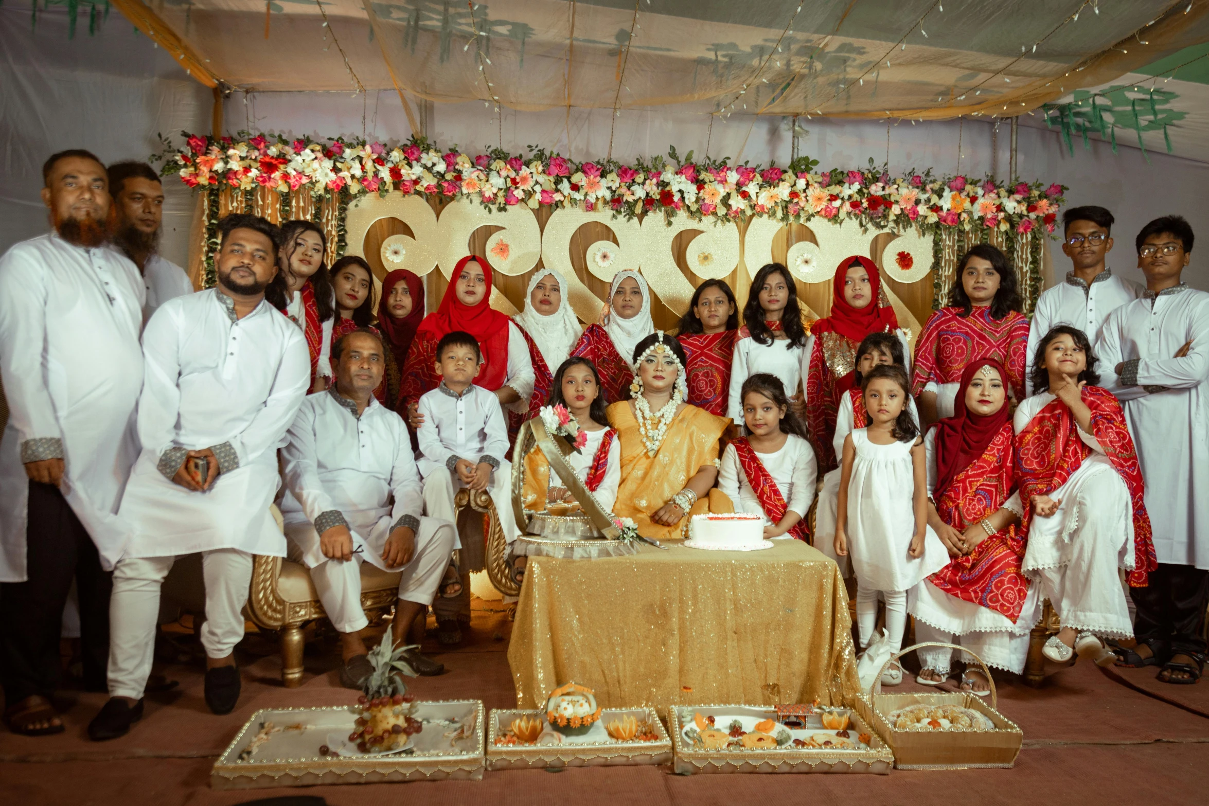 the group po shows some of the bride and groom at the wedding ceremony