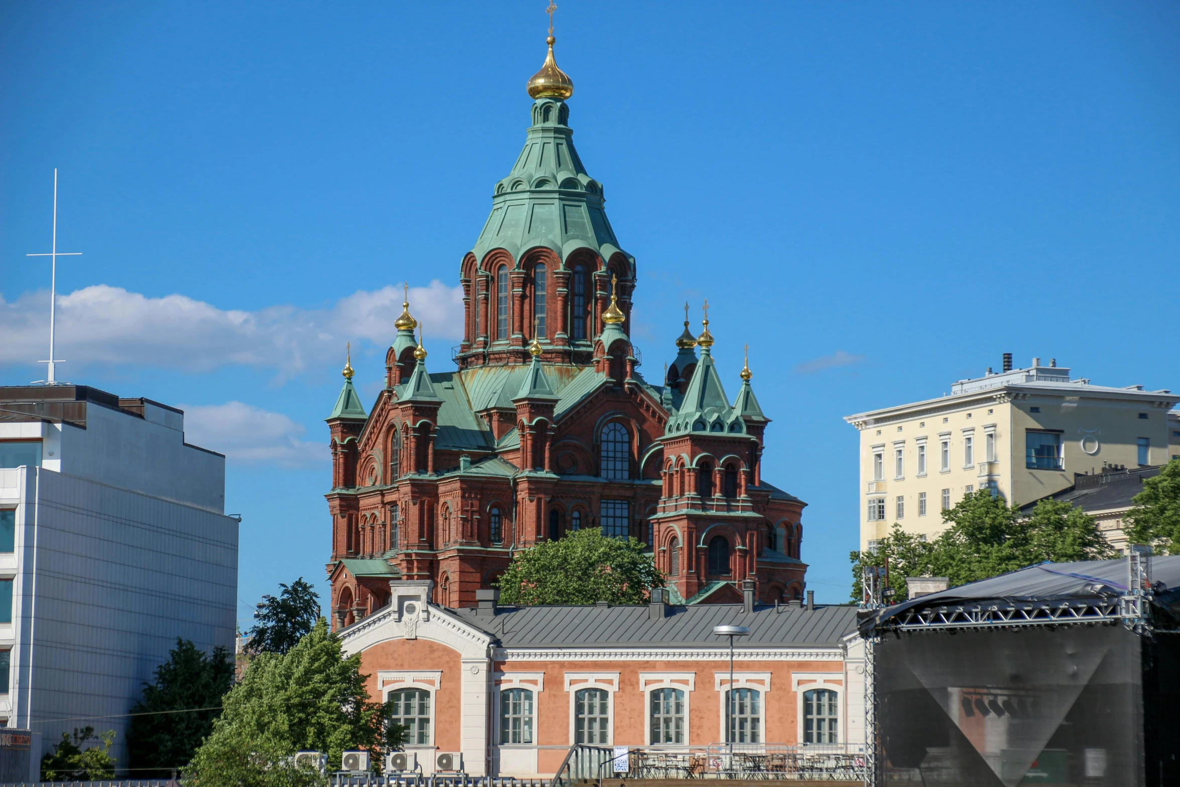 an old brick building has large domes and towers