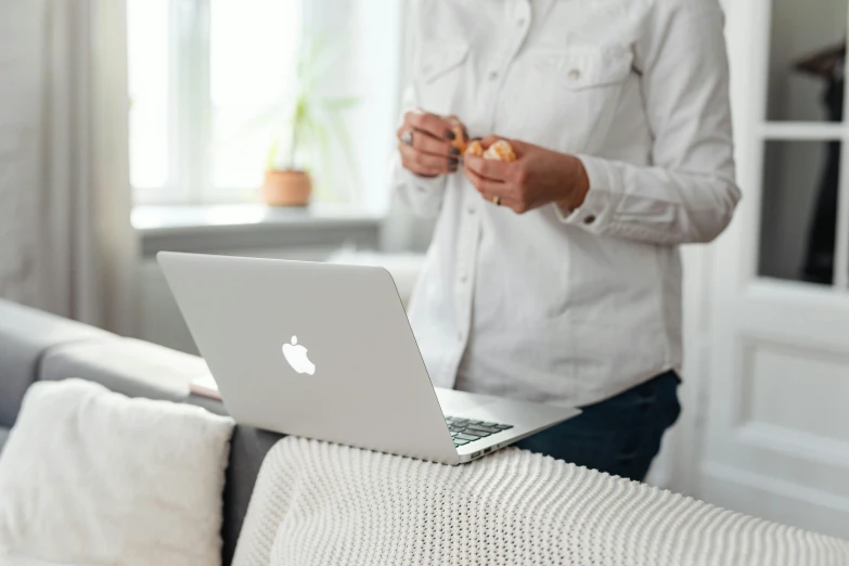 man holding his hand open and eating an apple