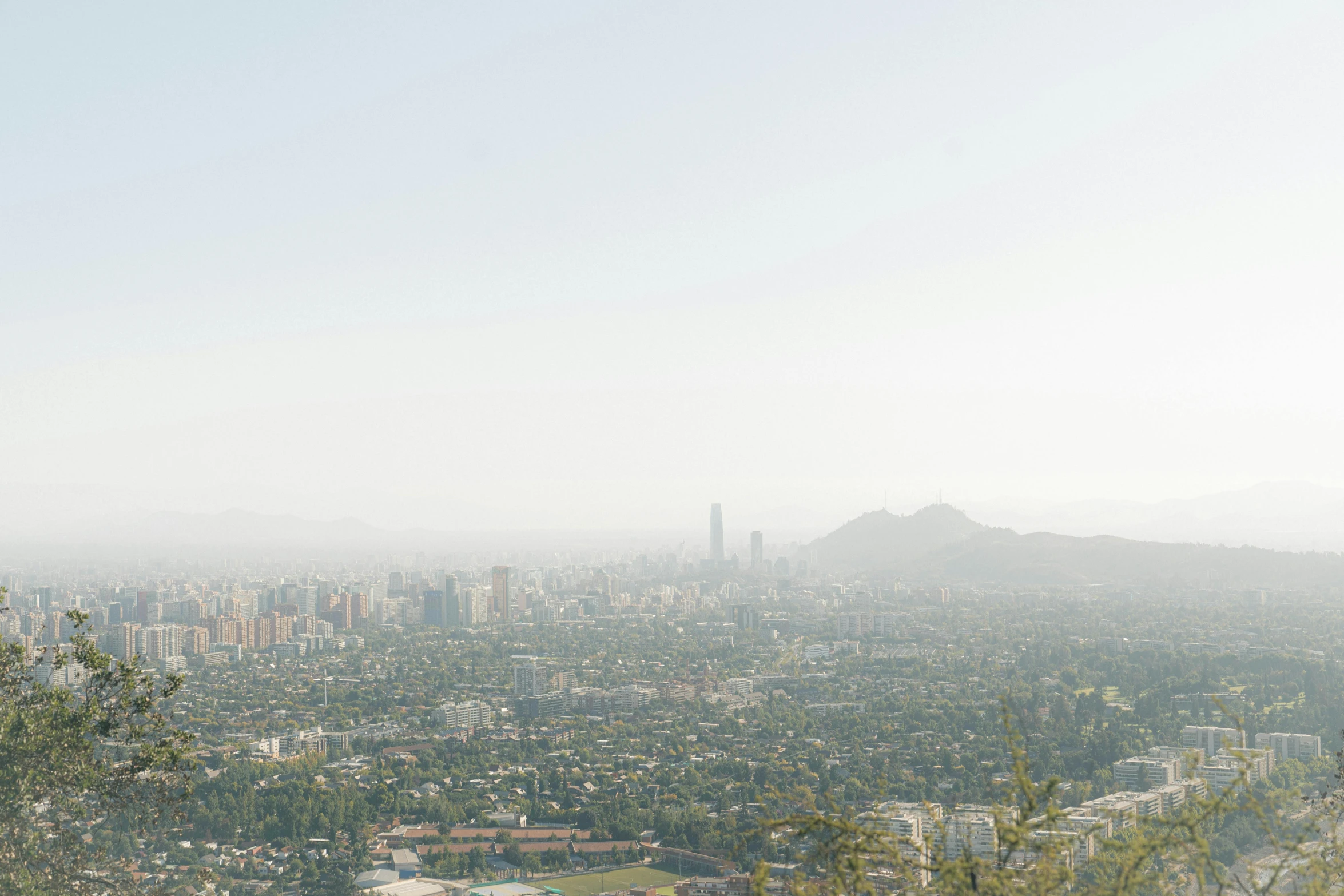 a view of a city from the top of a hill