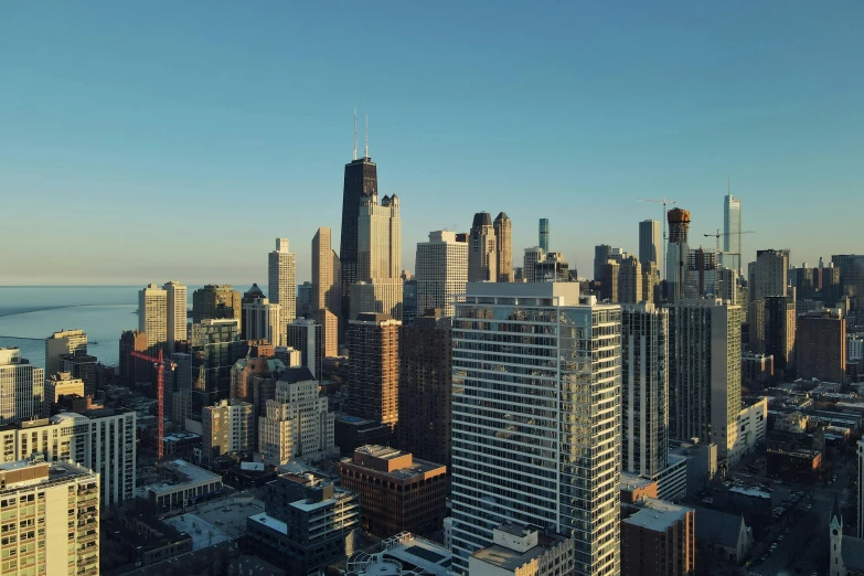 aerial po of a very tall city in the evening